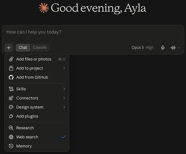 Claude's message box, with a switch between Chat and Cowork and the model and effort shown on the right, and the menu open under the + sign: Add files or photos, Add to project, Add from GitHub, Skills, Connectors, Design system, Add plugins, Research, Web search (ticked) and Memory.